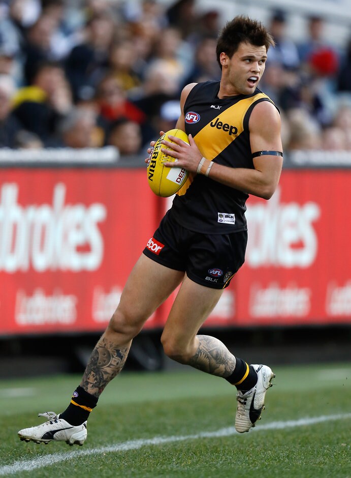 AFL 2016 Rd 21 - Richmond v Geelong MELBOURNE, AUSTRALIA - AUGUST 14: Ben Lennon of the Tigers in action during the 2016 AFL Round 21 match between the Richmond Tigers and the Geelong Cats at the Melbourne Cricket Ground on August 14, 2016 in Melbourne, Australia. (Photo by Michael Willson/AFL Media)